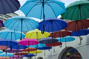  Colorful umbrellas background. Colorful umbrellas in the sky. Street decoration.