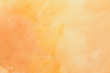 Abstract mixed gradient brown, orange and yellow watercolor on paper. The color splashing in the paper. It is a hand drawn.