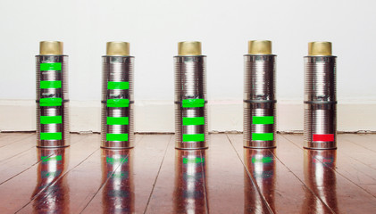 a line of tin can battarys from fully charged to emty