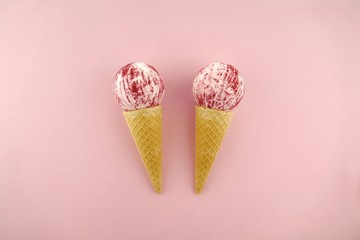 bath bomb.Pink Striped Bomb Bath in waffle cone  on a light pink pastel background.Organic body cosmetics.Cosmetic fashion concept