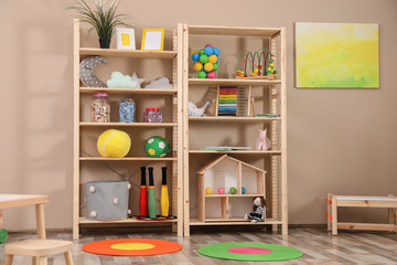 Storage for toys in colorful child's room. Idea for interior design