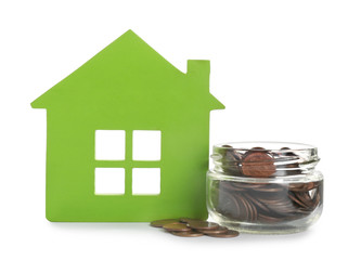 Model of house and jar with coins isolated on white