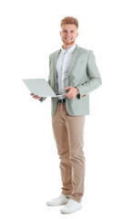 Fototapeta na wymiar Young man with laptop on white background