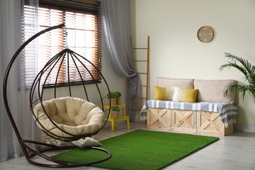 Stylish modern room interior with swing chair