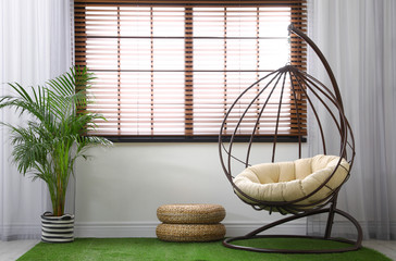 Stylish modern room interior with swing chair