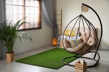 Stylish modern room interior with swing chair