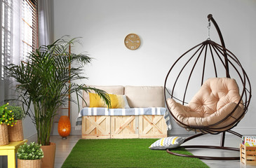 Stylish modern room interior with swing chair