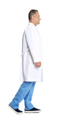 Full length portrait of experienced doctor in uniform on white background. Medical service