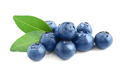 Fresh raw tasty blueberries with leaves isolated on white