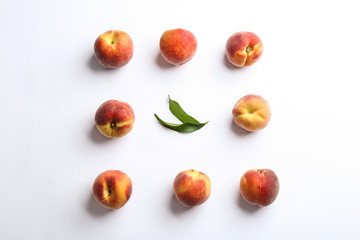 Fototapeta na wymiar Composition with fresh peaches on white background, top view