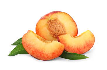 Sweet juicy cut peaches with leaves on white background