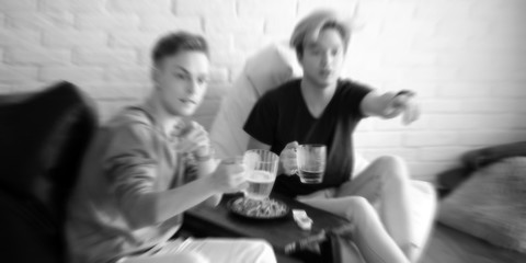 background football fans watch the match and drink beer