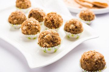 Leftover chapati Laddu / Churma Laddoo or Policha Ladu made with Roti, peanuts, dry fruits and jaggery. selective focus 