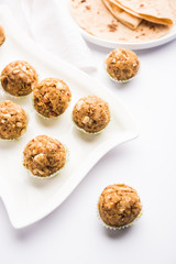 Leftover chapati Laddu / Churma Laddoo or Policha Ladu made with Roti, peanuts, dry fruits and jaggery. selective focus 