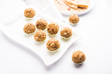Leftover chapati Laddu / Churma Laddoo or Policha Ladu made with Roti, peanuts, dry fruits and jaggery. selective focus 