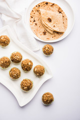 Leftover chapati Laddu / Churma Laddoo or Policha Ladu made with Roti, peanuts, dry fruits and jaggery. selective focus 