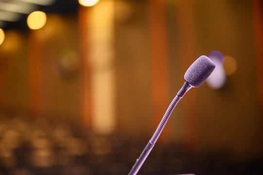 Microphone over the blurred business forum Meeting or Conference Room Concept, Blurred background.