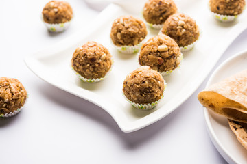 Leftover chapati Laddu / Churma Laddoo or Policha Ladu made with Roti, peanuts, dry fruits and jaggery. selective focus 