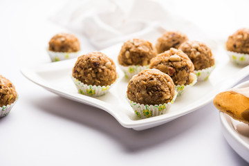 Leftover chapati Laddu / Churma Laddoo or Policha Ladu made with Roti, peanuts, dry fruits and jaggery. selective focus 