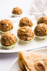 Leftover chapati Laddu / Churma Laddoo or Policha Ladu made with Roti, peanuts, dry fruits and jaggery. selective focus 