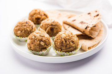 Leftover chapati Laddu / Churma Laddoo or Policha Ladu made with Roti, peanuts, dry fruits and jaggery. selective focus 
