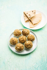 Leftover chapati Laddu / Churma Laddoo or Policha Ladu made with Roti, peanuts, dry fruits and jaggery. selective focus 