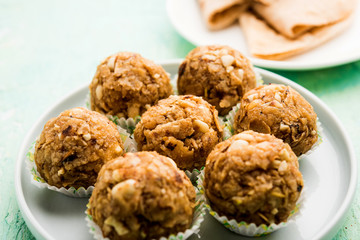 Leftover chapati Laddu / Churma Laddoo or Policha Ladu made with Roti, peanuts, dry fruits and jaggery. selective focus 