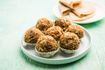 Leftover chapati Laddu / Churma Laddoo or Policha Ladu made with Roti, peanuts, dry fruits and jaggery. selective focus 
