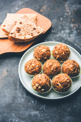 Leftover chapati Laddu / Churma Laddoo or Policha Ladu made with Roti, peanuts, dry fruits and jaggery. selective focus 