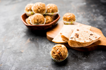 Leftover chapati Laddu / Churma Laddoo or Policha Ladu made with Roti, peanuts, dry fruits and jaggery. selective focus 