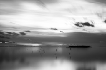 Beautiful long exposure view of Trasimeno Lake (Umbria, Italy), with still water