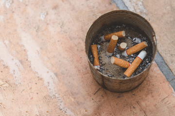 Many types of cigarette butts are left in the ashtray