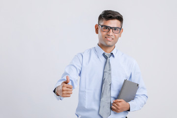 Indian Man Showing Thumps Up And  Holding Book in hand 