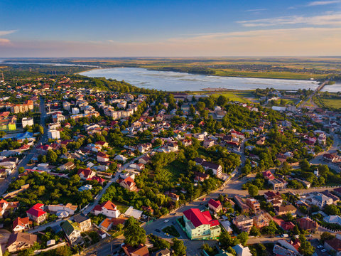 Aerial view of Slatina city and river Olt, Romania. Drone flight over the european city in summer day.