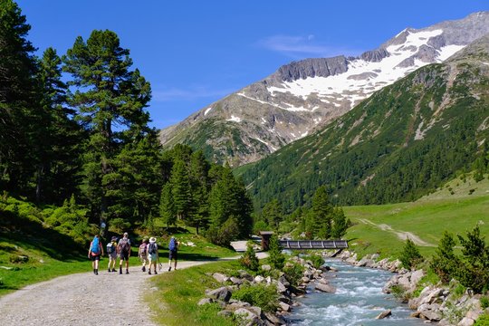 Hiking group at Zamserbach, Zamser Grund, Zillertal Alps, Zillertal, Tyrol, Austria, Europe