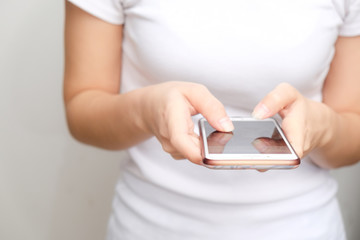 Beautiful women typing text smartphone on white background