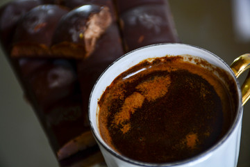 Black coffee with chocolate, reflection.	