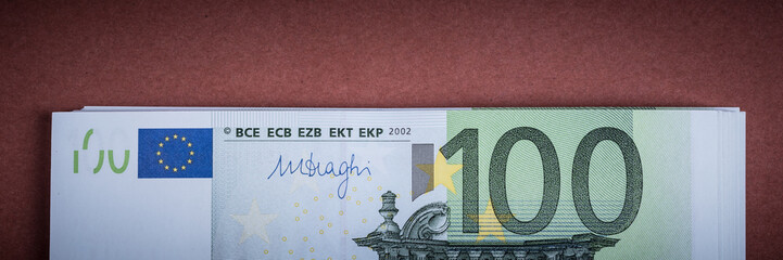 Euro cash on a pink and brown background. Euro Money Banknotes. Euro Money. Euro bill. Place for text.