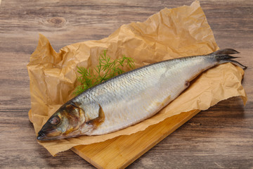 Salted herring over the wooden board