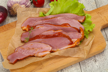 Sliced smoked duck breast served salad