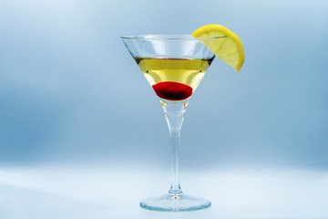 Martini with olive and lemon.