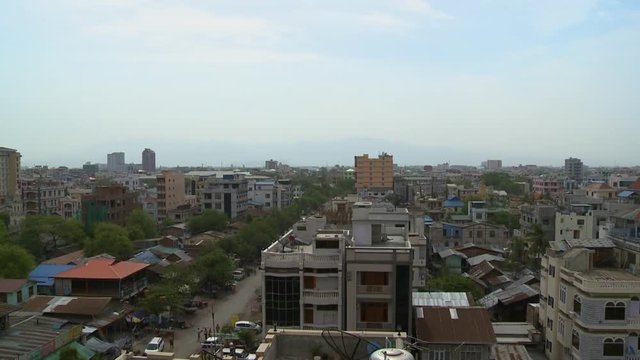 A high angle shot of tall buildings in a city in Myanmar