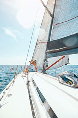 Fototapeta premium Man and woman in love on a yacht in the summer.