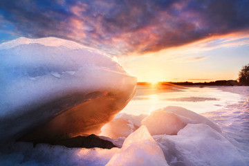 Sun shining through ice during winter