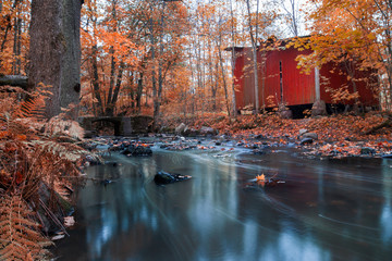 Old abandoned house on a river bank