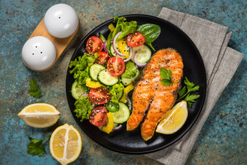 Grilled salmon fish steak with vegetables.