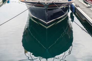composition of sailboat moored to port
