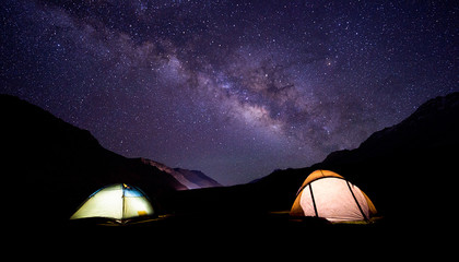 camping under milkyway with twinkling stars in the background 