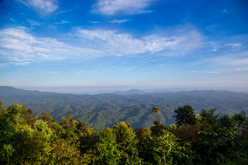 Fototapeta na wymiar Mountains landscape view in rain forest with blue sky. Beautiful scenery view in countryside of asia.