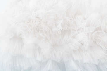 White tule background with soft ruffled fabric 